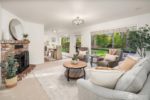 23350 SE 22nd St, Sammamish, WA 98075 - carpeted living area featuring a fireplace and a chandelier