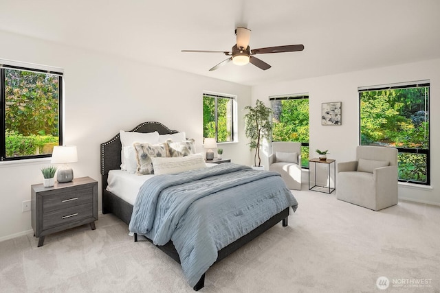23350 SE 22nd St, Sammamish, WA 98075 - bedroom featuring light colored carpet, multiple windows, and ceiling fan