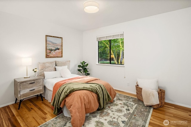 23350 SE 22nd St, Sammamish, WA 98075 - bedroom with wood finished floors and baseboards