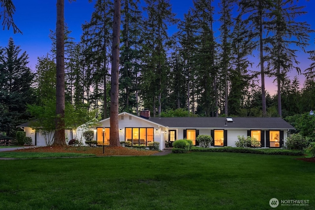 23350 SE 22nd St, Sammamish, WA 98075 - single story home with a front yard, a chimney, and an attached garage