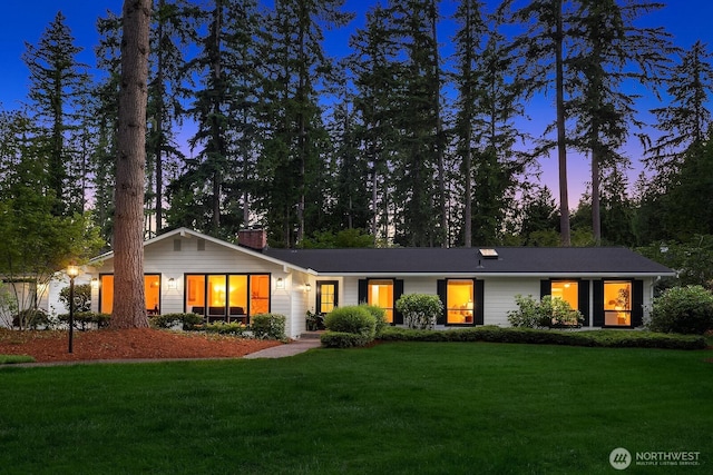 23350 SE 22nd St, Sammamish, WA 98075 - view of front of house with a front lawn and a chimney