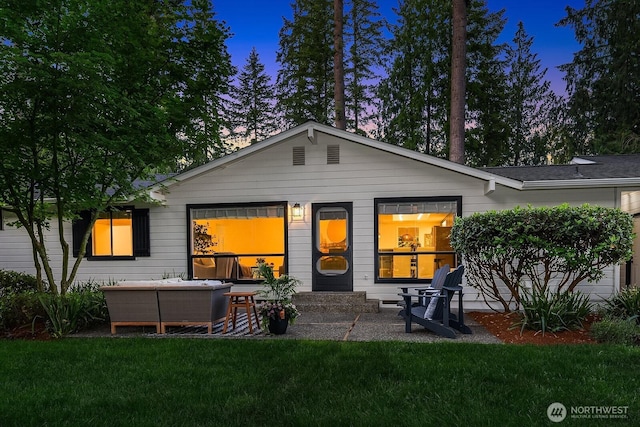 23350 SE 22nd St, Sammamish, WA 98075 - back of property at dusk with a yard and an outdoor hangout area