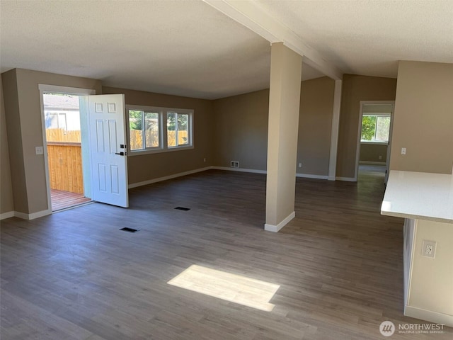 8102 195th St E Unit 95, Spanaway, WA 98387 - unfurnished living room featuring wood finished floors and a textured ceiling