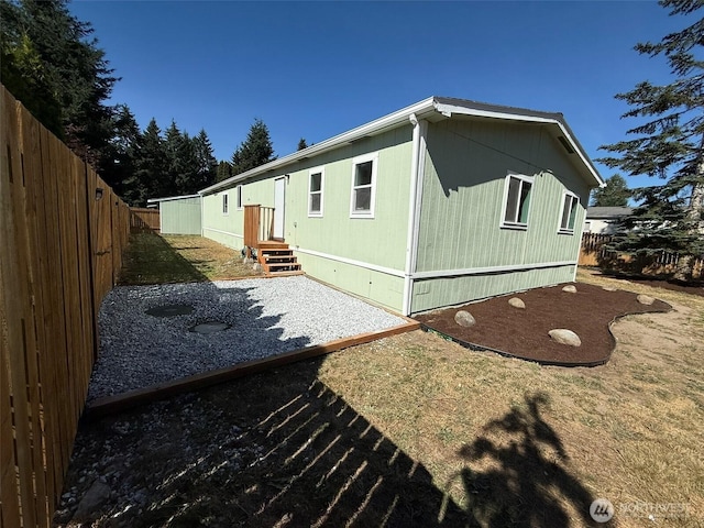 8102 195th St E Unit 95, Spanaway, WA 98387 - back of property with a patio area and a fenced backyard