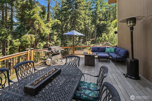 61 Tom And Nita Rd, Cle Elum, WA 98922 - wooden deck with area for grilling and an outdoor living space with a fire pit