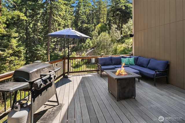 61 Tom And Nita Rd, Cle Elum, WA 98922 - deck with grilling area, an outdoor living space with a fire pit, and a forest view