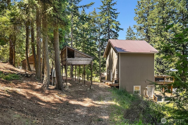 61 Tom And Nita Rd, Cle Elum, WA 98922 - view of side of property with a metal roof and a deck