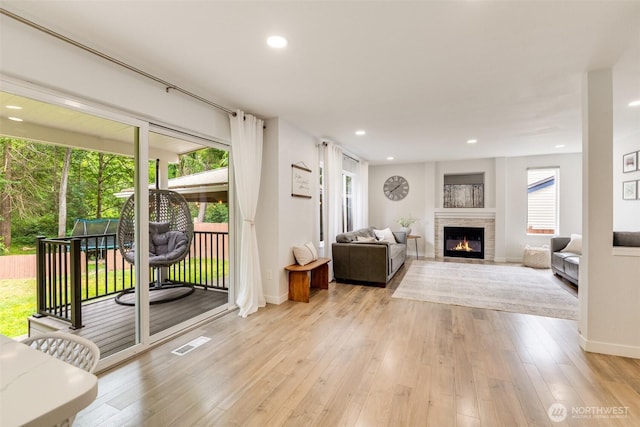 36318 30th Ave S, Federal Way, WA 98003 - living room featuring a glass covered fireplace, light wood finished floors, and recessed lighting