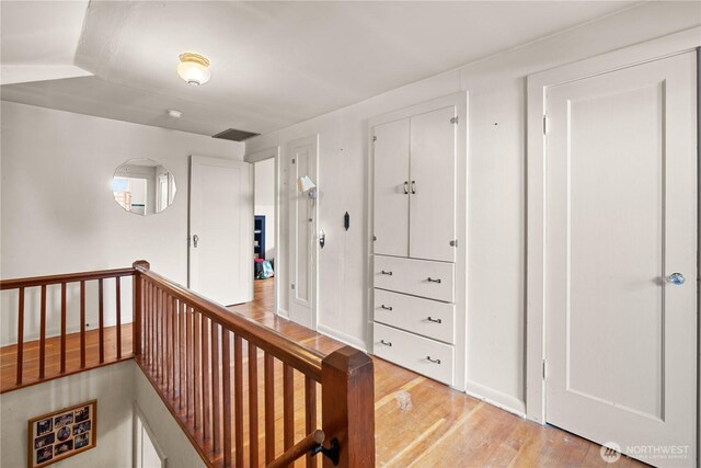 235 S 59th St, Tacoma, WA 98408 - corridor featuring an upstairs landing and light wood-type flooring