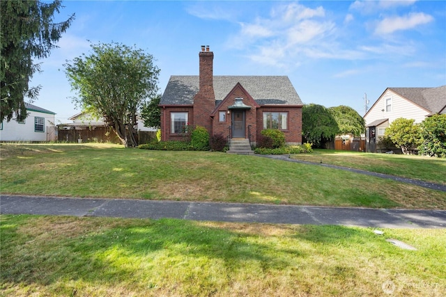 235 S 59th St, Tacoma, WA 98408 - english style home with a chimney and brick siding