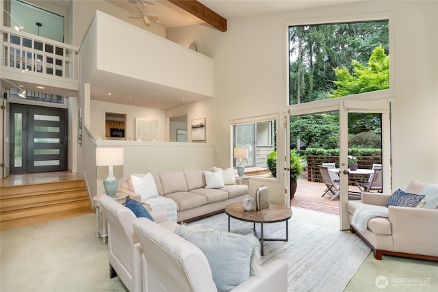 22526 53rd Ave SE, Bothell, WA 98021 - living room featuring a towering ceiling, beam ceiling, ceiling fan, and carpet