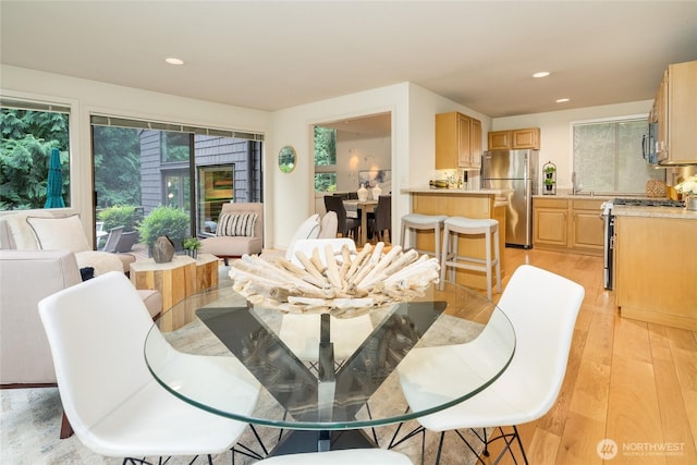 22526 53rd Ave SE, Bothell, WA 98021 - dining space with light wood-style floors and recessed lighting