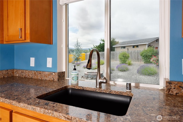 541 Salal Pl, Sequim, WA 98382 - kitchen view of dark stone countertops and brown cabinetry