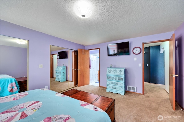 541 Salal Pl, Sequim, WA 98382 - carpeted bedroom with a textured ceiling and a closet
