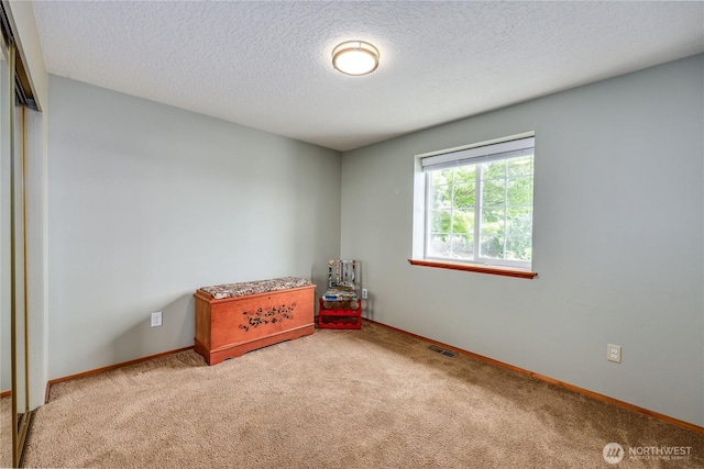 541 Salal Pl, Sequim, WA 98382 - carpeted bedroom featuring a textured ceiling and a closet