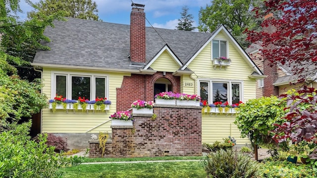 2463 26th Ave E, Seattle, WA 98112 - view of front facade with a shingled roof and a chimney