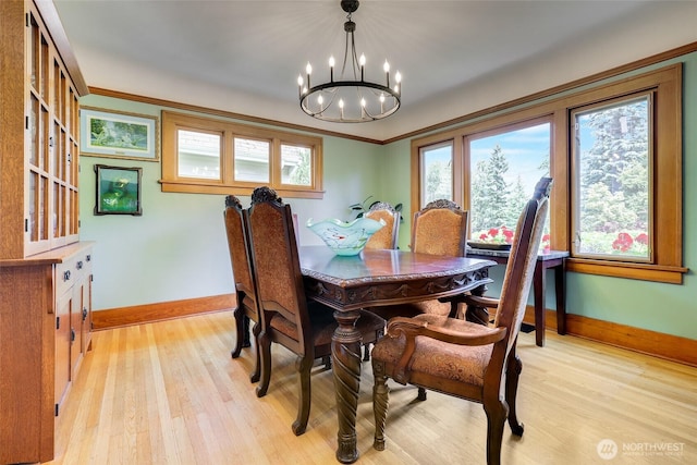 2463 26th Ave E, Seattle, WA 98112 - dining room featuring a chandelier, light wood finished floors, and ornamental molding