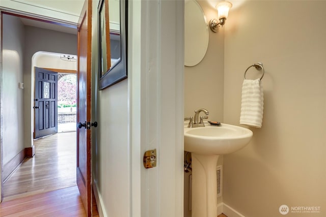 2463 26th Ave E, Seattle, WA 98112 - half bathroom with wood finished floors and baseboards