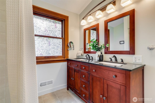 2463 26th Ave E, Seattle, WA 98112 - bathroom with double vanity and tile patterned floors