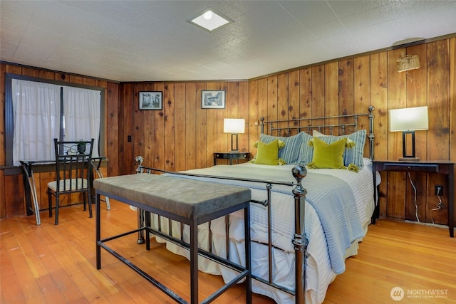 2463 26th Ave E, Seattle, WA 98112 - bedroom with hardwood / wood-style flooring and wooden walls