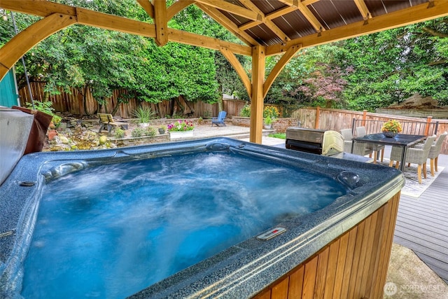 2463 26th Ave E, Seattle, WA 98112 - view of swimming pool featuring a hot tub, a deck, a fenced backyard, and a gazebo