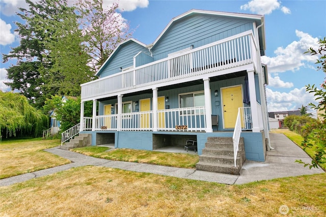 3572-3574 E F St, Tacoma, WA 98404 - view of front of house with covered porch, a front lawn, and a balcony