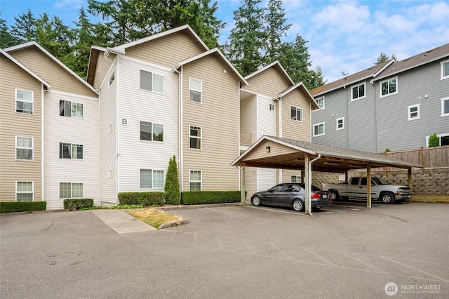 5809 Highway Pl Unit B304, Everett, WA 98203 - view of property featuring covered parking