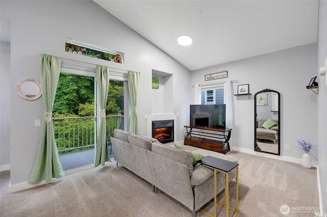 5809 Highway Pl Unit B304, Everett, WA 98203 - living room featuring carpet floors, a glass covered fireplace, and high vaulted ceiling