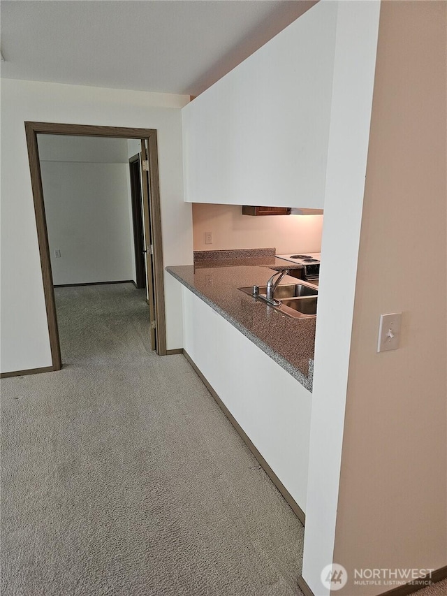 1750 152nd Ave NE Unit C310, Bellevue, WA 98007 - kitchen with carpet and dark countertops