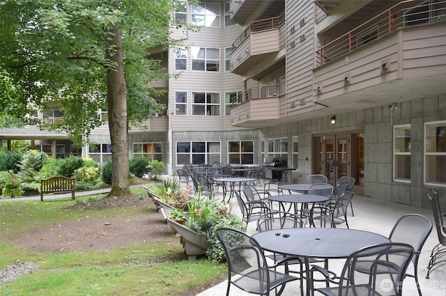 1750 152nd Ave NE Unit C310, Bellevue, WA 98007 - view of patio / terrace with area for grilling and french doors
