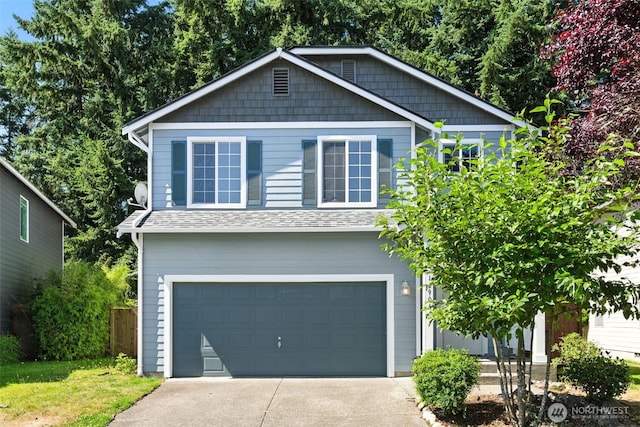 12904 159th St E, Puyallup, WA 98374 - view of front facade featuring driveway, an attached garage, and roof with shingles