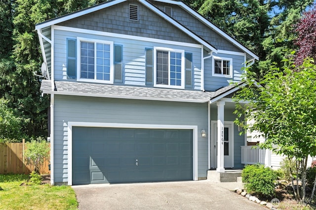 12904 159th St E, Puyallup, WA 98374 - view of front of home with an attached garage, driveway, a porch, and roof with shingles