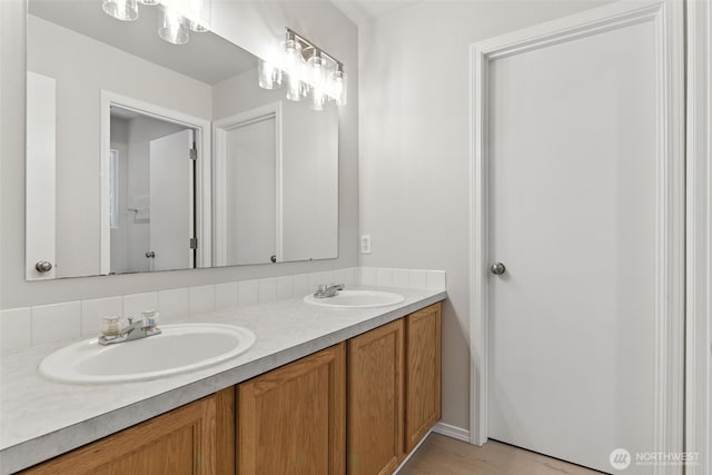 12904 159th St E, Puyallup, WA 98374 - full bathroom featuring double vanity and wood finished floors