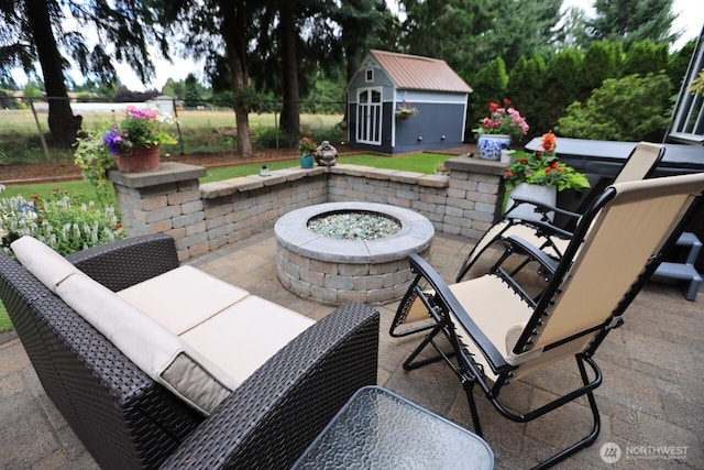 4442 Prestwick Ln SE, Lacey, WA 98513 - view of patio with an outdoor fire pit and a shed