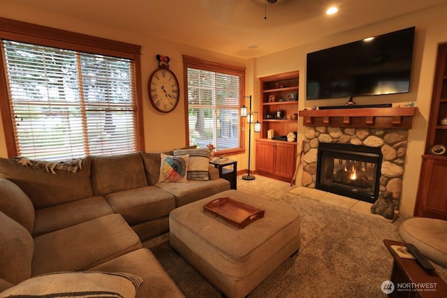4442 Prestwick Ln SE, Lacey, WA 98513 - living area featuring light carpet, a stone fireplace, and built in features