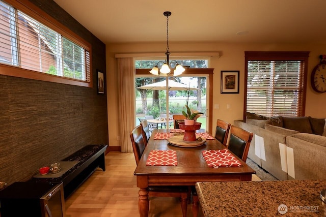 4442 Prestwick Ln SE, Lacey, WA 98513 - dining room featuring a chandelier and light wood-type flooring