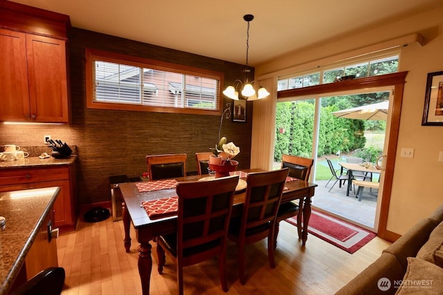 4442 Prestwick Ln SE, Lacey, WA 98513 - dining space featuring light wood-type flooring and a chandelier