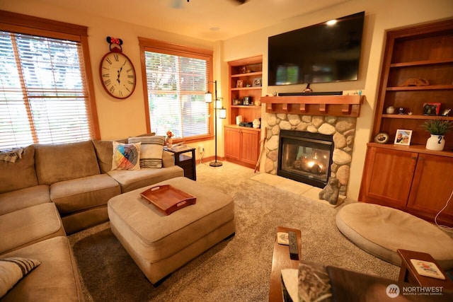 4442 Prestwick Ln SE, Lacey, WA 98513 - living area with a stone fireplace, light carpet, and built in features