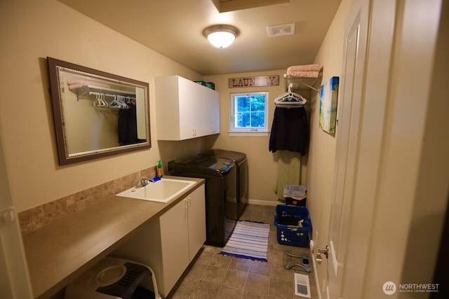 4442 Prestwick Ln SE, Lacey, WA 98513 - laundry room featuring cabinet space, washer and clothes dryer, and tile patterned floors