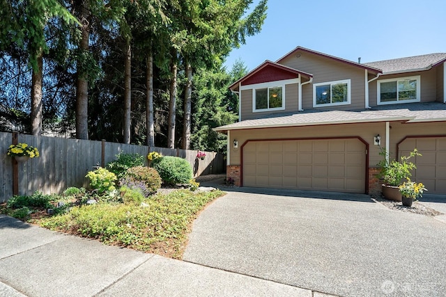527 Cypress Ave, Snohomish, WA 98290 - view of front of home with asphalt driveway, brick siding, an attached garage, and a shingled roof