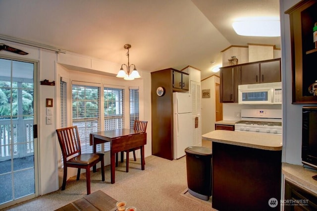 35 Branch Cir, Deming, WA 98244 - kitchen featuring white appliances, a chandelier, light countertops, vaulted ceiling, and light colored carpet