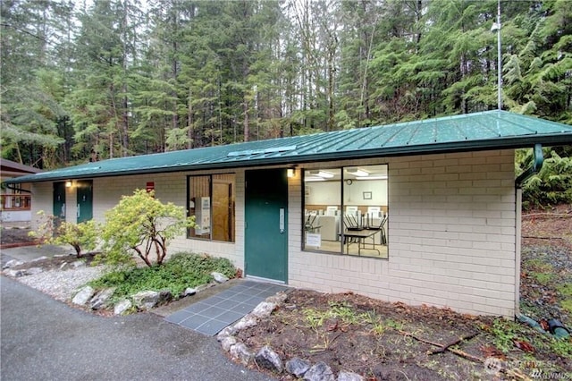 35 Branch Cir, Deming, WA 98244 - view of front facade featuring a metal roof and a view of trees