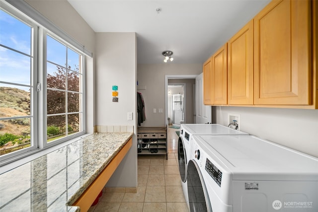 591 Daniels Dr NE, East Wenatchee, WA 98802 - washroom with cabinet space, light tile patterned flooring, and washer and dryer