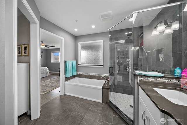 591 Daniels Dr NE, East Wenatchee, WA 98802 - full bath featuring a bath, a stall shower, ensuite bathroom, vanity, and recessed lighting