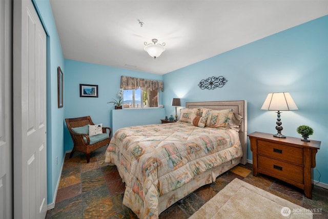 591 Daniels Dr NE, East Wenatchee, WA 98802 - bedroom featuring stone tile floors and a closet