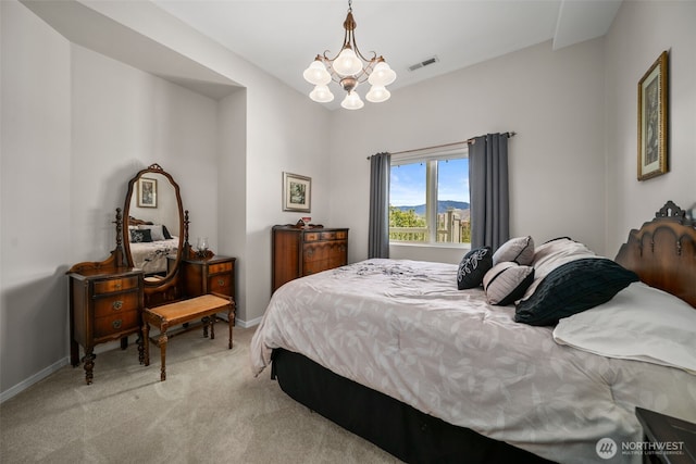 591 Daniels Dr NE, East Wenatchee, WA 98802 - bedroom with light carpet and a chandelier