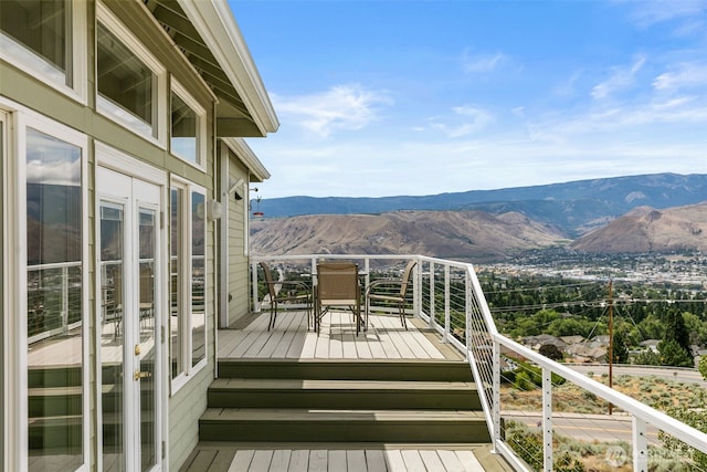 591 Daniels Dr NE, East Wenatchee, WA 98802 - wooden terrace with a mountain view and outdoor dining space