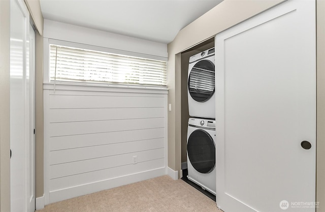 1816 N 155th St, Shoreline, WA 98115 - laundry room with stacked washer and clothes dryer, healthy amount of natural light, and carpet