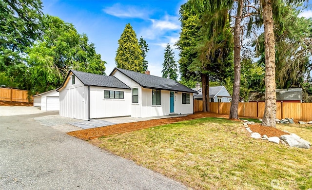 1816 N 155th St, Shoreline, WA 98115 - view of front of home featuring an outbuilding, a chimney, and a shingled roof