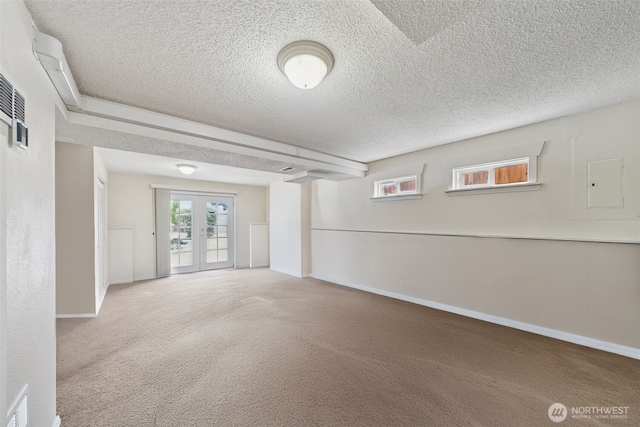 4610 N Defiance St, Tacoma, WA 98407 - basement featuring electric panel, carpet flooring, a textured ceiling, and french doors